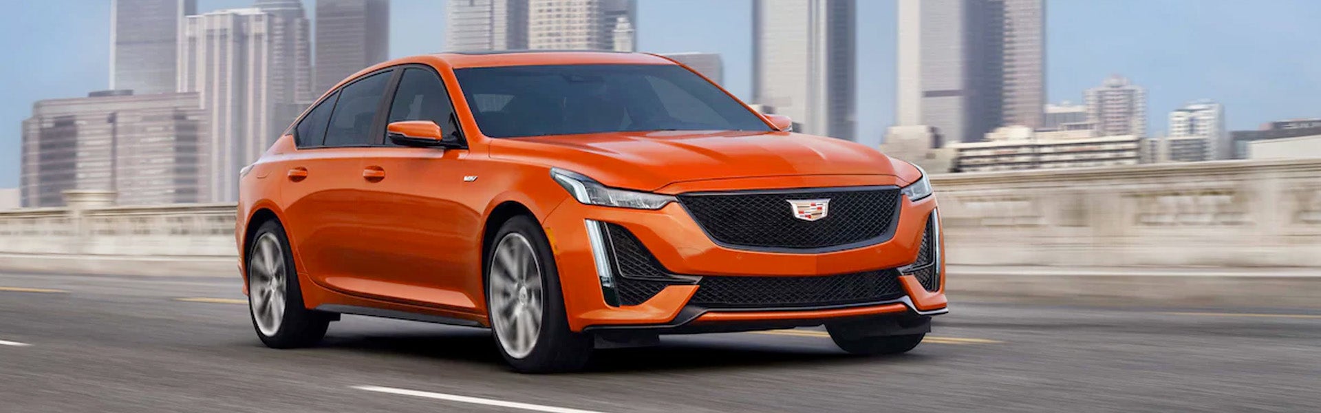 Orange 2022 Cadillac CT5-V Blackwing driving on road