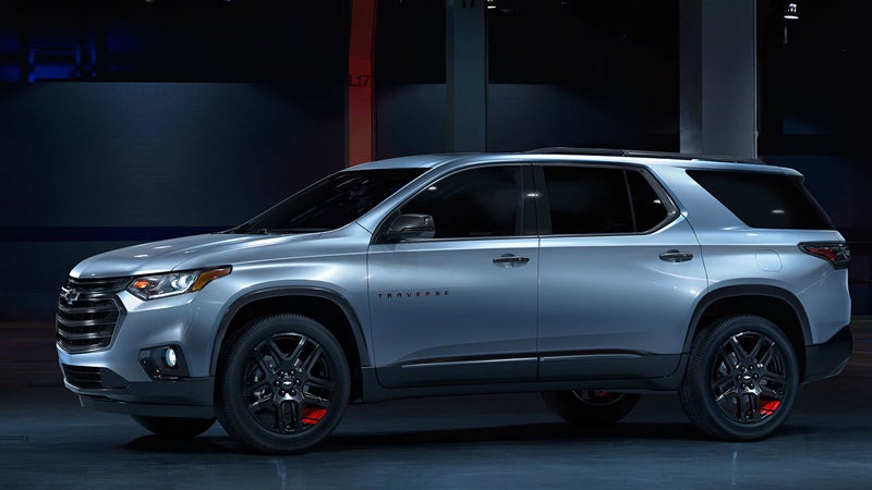 Silver 2018 Chevy Traverse in city at night