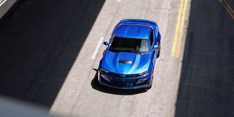 Blue Chevy Camaro driving overhead view