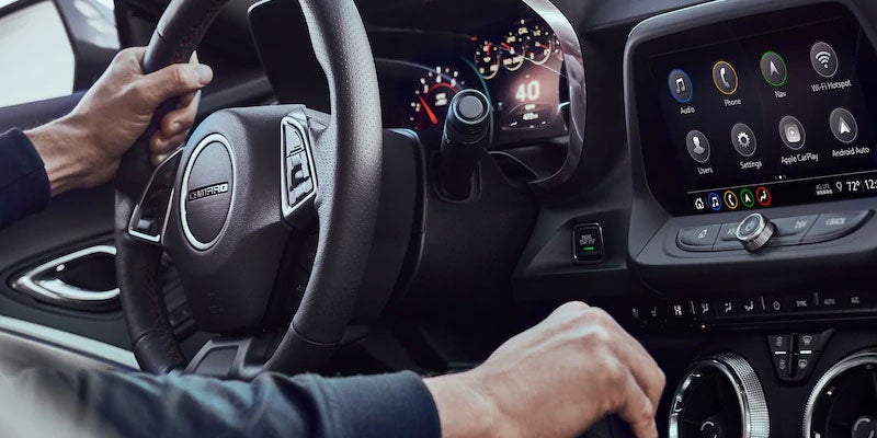 Man driving Chevy Camaro