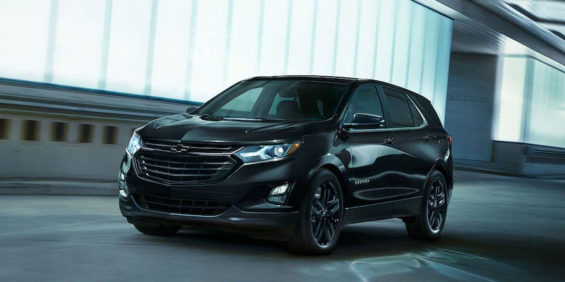 Black 2021 Chevy Equinox in city at night