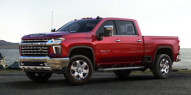 Red 2021 Chevy Silverado 2500 by the water