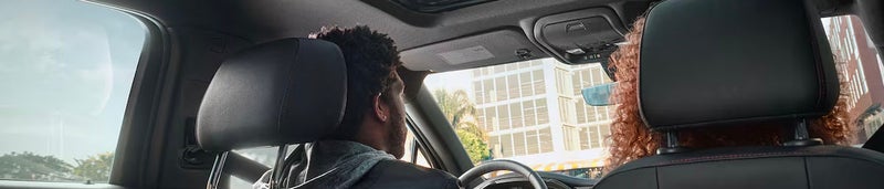 Chevrolet Blazer interior design and someone in the driver seat driving the vehicle