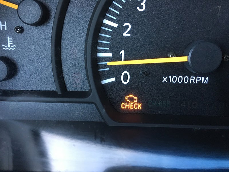 Check engine light on the dashboard suggesting to bring the car into service at Murdock Manhattan Chevrolet